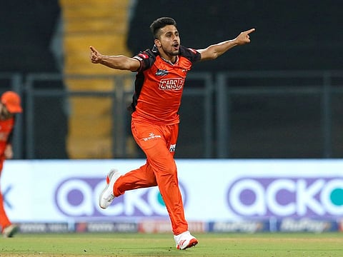 Umran Malik celebrates the wicket of Shubhman Gill of the Gujarat Titans during his five-wicket haul late last month.