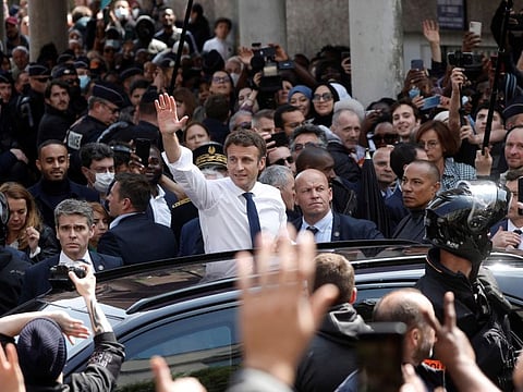 Newly reelected French President Emmanuel Macron during his visit at the Saint-Christophe market square in Cergy, a Paris suburb, on April 27, 2022.