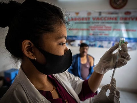 A nurse prepares to administer vaccine for COVID-19 at a private vaccination center in Guwahati.
