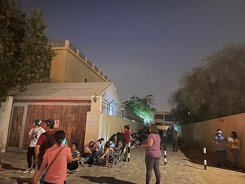 Filipinos lining up before dawn at Philippine Overseas Labour Office in Dubai last month.