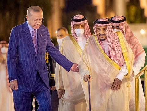 King Salman escorting Erdogan during a meeting in Saudi Arabia's Red Sea coastal city of Jeddah.