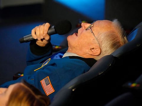 Retired Nasa astronaut Charlie Duke reclines as he narrates a video of his trip to the moon for a group of middle school students at the South Carolina State Museum on April 29, 2022, in Columbia.
