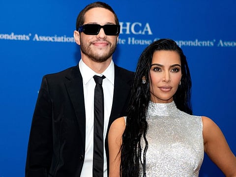 US comedian Pete Davidson (L) and US television personality Kim Kardashian arrive for the White House Correspondents Association gala at the Washington Hilton Hotel in Washington, DC, on April 30, 2022. (Photo by Stefani Reynolds / AFP)