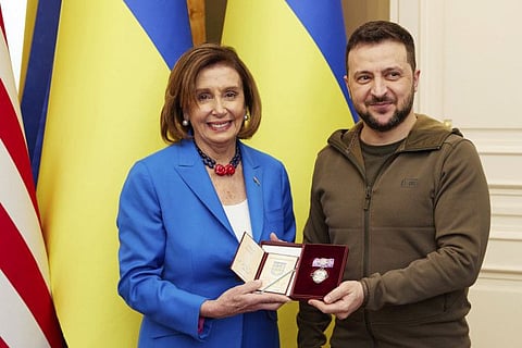 Ukrainian President Volodymyr Zelenskyy, right, awards the Order of Princess Olga, the third grade, to US Speaker of the House Nancy Pelosi in Kyiv, April 30, 2022.