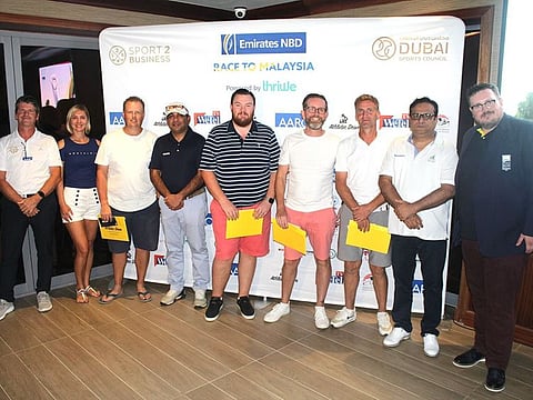 Winners of the respective divisions in the qualifiers for the Emirates NBD Race to Malaysia with Saurabh Lodha, Emirates NBD Business Manager, sponsors, organisers and Arabian Ranches Golf Club Men's Captain Paul Bryson at Arabian Ranches Golf Club.