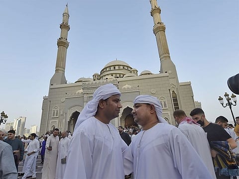 Residents greet each other at Al Noor Mosque in Sharjah.