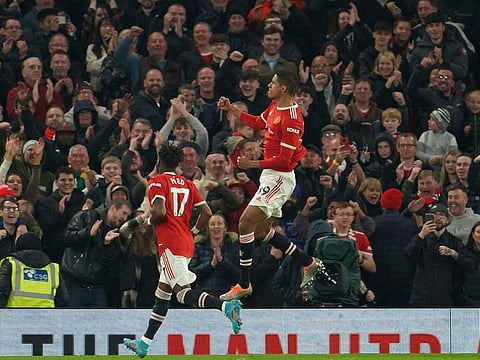 Manchester United's Raphael Varane, centre, celebrates after scoring.