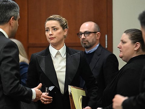US actress Amber Heard stands in the courtroom at the Fairfax County Circuit Court in Fairfax, Virginia, on May 3, 2022.