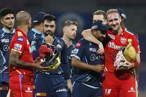 Gujarat and Punjab players return to the pavilion after Kings won Match 48 of the TATA Indian Premier League 2022 at DY Patil Stadium in Mumbai on the Tuesday.