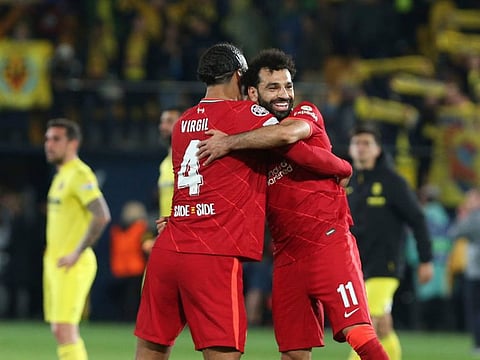 Liverpool's Virgil van Dijk (left) and Mohamed Salah celebrate after winning the Champions League semi-final second leg against Villarreal at Ceramica stadium in Spain on Tuesday.