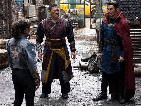 Xochitl Gomez as America Chavez, Benedict Wong as Wong, and Benedict Cumberbatch as Doctor Strange.