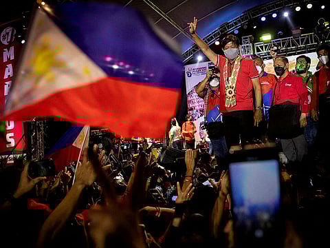 Philippine presidential candidate Ferdinand 'Bongbong' Marcos Jr., son of late dictator Ferdinand Marcos, gestures with a victory sign during a campaign rally in Lipa, Batangas province, Philippines.