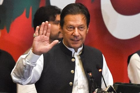 Former Pakistan's prime minister Imran Khan, who was ousted by opposition parties through a no-confidence motion, gestures as he addresses Pakistan Tehreek-e-Insaf (PTI) party workers during a party convention in Lahore on April 27, 2022.