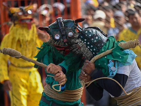Men in tiger costumes take part in the tiger fight during the rain petition ritual in Zitlala, Guerrero state, Mexico, on May 5, 2022.
