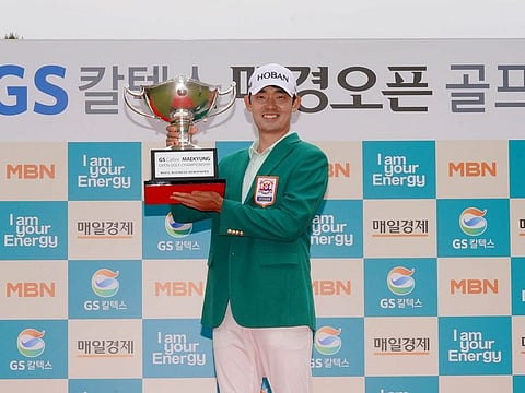 Champion Bio Kim (South Korea) with his trophy.
