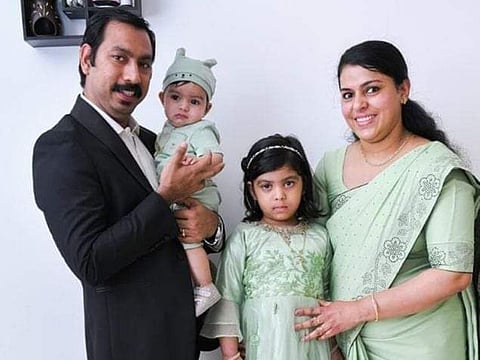 Sheba Mary Thomas seen here with her daughter Evelyn, son Edvin and husband Sajimon Raju