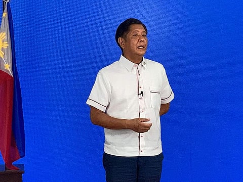 In this photo taken May 9, 2022, Presidential candidate Ferdinand Marcos Jr., son of the late strongman Ferdinand Marcos Sr., speaks to the members of the media, at his party headquarters in Manila.