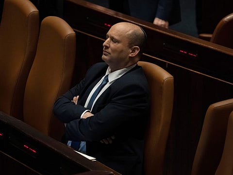 Israeli Prime Minister Naftali Bennett pauses during the opening of the summer session of the Knesset, Israel's parliament, in Jerusalem, Monday, May 9, 2022. Less than a year after taking office, Bennett has lost his parliamentary majority, his own party is crumbling and a key governing partner has suspended cooperation with the coalition. That has set the stage for a possible attempt by the opposition, led by former Prime Minister Benjamin Netanyahu, to topple the government later this week. (AP Photo/Maya Alleruzzo)