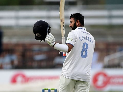 Cheteshwar Pujara, playing for Sussex, acknowledges cheers of the crowd on reaching century in the last game.