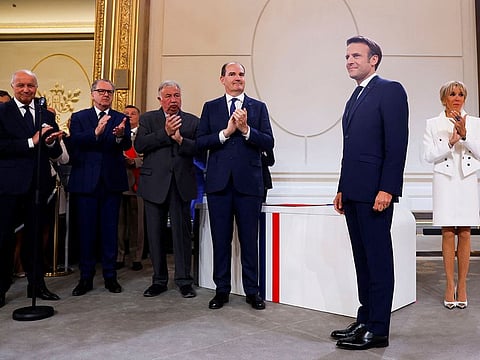 French President Emmanuel Macron stands during the ceremony of his inauguration for a second term at the Elysee palace, in Paris, France, Saturday, May 7, 2022