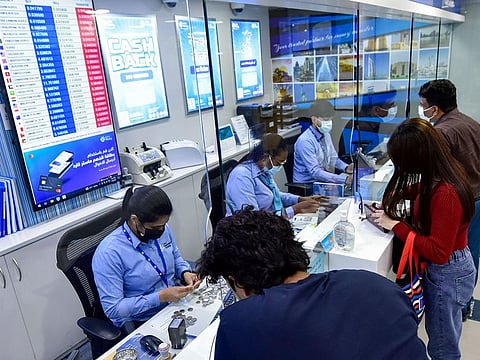 Customers at Lulu Exchange in Sharjah. The rupee went as high as 21.07 against the UAE dirham today. Here's why remitters are rushing to remit.