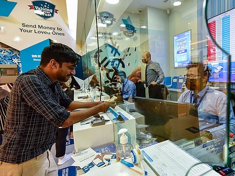 Customers at Lulu Exchange in Sharjah. New guidelines allow resident Indians to receive more money from their NRIs staying overseas, without having to inform the authorities.