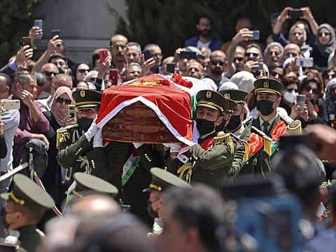 Palestinians attend a state funeral for veteran Al Jazeera journalist Shireen Abu Akleh at the presidential headquarters in the West Bank city of Ramallah on May 12, 2022.