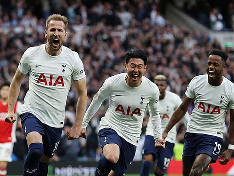 Tottenham Hotspur's Harry Kane celebrates scoring their first goal with Son Heung-min and Ryan Sessegnon.