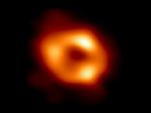 This is the first image of Sagittarius A* (or Sgr A* for short), the supermassive black hole at the center of our galaxy. It was captured by the Event Horizon Telescope (EHT), an array which linked together radio observatories across the planet to form a single "Earth-sized" virtual telescope.