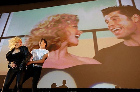 Dancers perform during the final scene of the Future Cinema outdoor screening of the 1978 film "Grease" in Barnes, southwest London September 9, 2012.