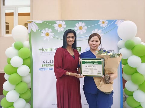 Nurse Jessica Olinares being recognised for her services in Abu Dhabi on the occasion of International Nursing Day.