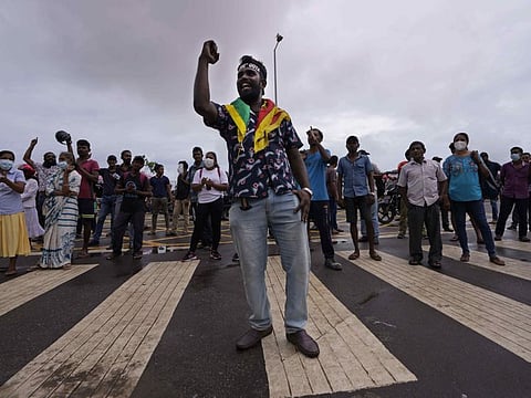 Sri Lankans protest demanding president Gotabaya Rajakasa resign and decrying the appointment of Prime Minister Ranil Wickeremesinghe in Colombo, Sri Lanka, Friday, May 13, 2022.