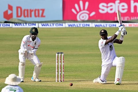 Sri Lanka's Angelo Mathews (right) plays a shot as Bangladesh's wicketkeeper Liton Das watches during the first day of the first Test match at the Zahur Ahmed Chowdhury Stadium in Chittagong.