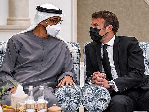 President His Highness Sheikh Mohamed bin Zayed Al Nahyan with France's President Emmanuel Macron (right) at Mushrif Palace in Abu Dhabi on May 15, 2022.