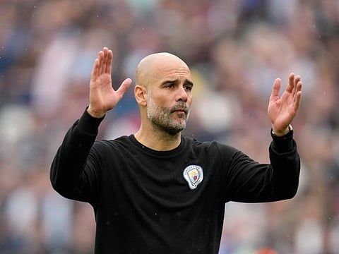 Manchester City's head coach Pep Guardiola reacts at the end of the English Premier League match against West Ham United at London stadium in London.