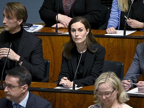 Finnish Prime Minister Sanna Marin looks on during the plenary session at the Finnish parliament, as Finnish legislators have voted and decided that Finland will seek the Nato membership in Helsinki, on May 17, 2022.