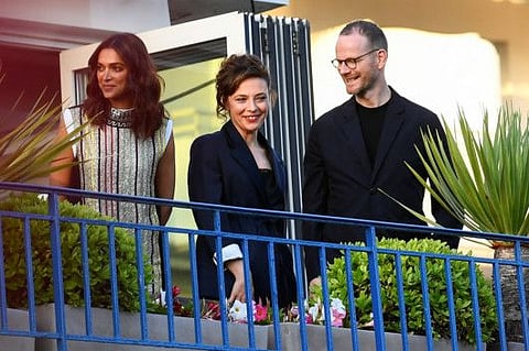 The 75th Cannes Film Festival - Jury dinner . Jury members Deepika Padukone, Jasmine Trinca and Joachim Trier, stand on a balcony at the Hotel Martinez on the eve of the opening of the Cannes Film Festival.