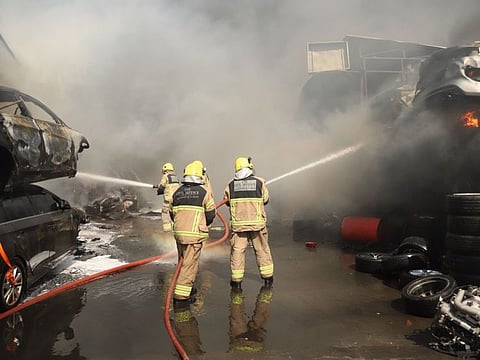 Sharjah Civil Defence personnel at work.