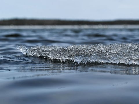 Ice melts on the water near the Centennial Park entrance to the Dettah Ice Road after it was closed for the season across the Great Slave Lake in Yellowknife, Northwest Territories, Canada, on May 17, 2022. The Royal Tour of Canada by their Royal Highnesses The Prince of Wales and The Duchess of Cornwall is scheduled to include a visit on May 19 with climate change experts at the Dettah Ice Road about the impact of climate change in the region and the importance of Indigenous-led initiatives.