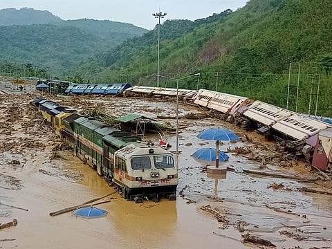 Train coaches are seen toppled over following mudslides triggered by heavy rains at New Haflong railway station on the Lumding-Silchar route at Dima Hasao district, in northeastern Assam state.