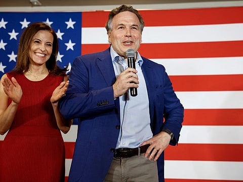 Republican Party US Senate candidate David McCormick speaks to supporters alongside his wife, Dina Powell McCormick, at an election night event in Pittsburgh, Pennsylvania, U.S. May 17, 2022.