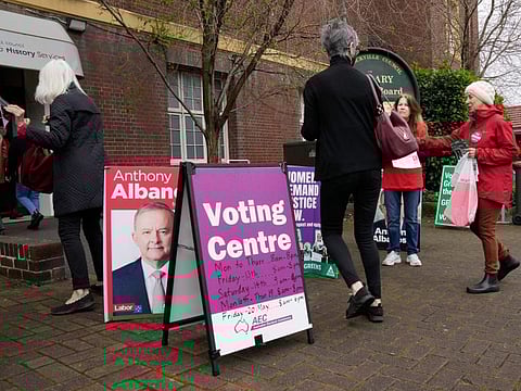 Voters walk into a pre-polling booth in Sydney, Australia, Friday, May 20, 2022.