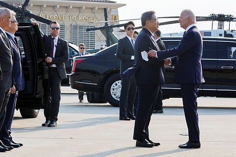 South Korea's Foreign Minister Park Jin greets US President Joe Biden as he arrives at Osan Air Base (ROK) in Pyeongtaek, South Korea, May 20, 2022.