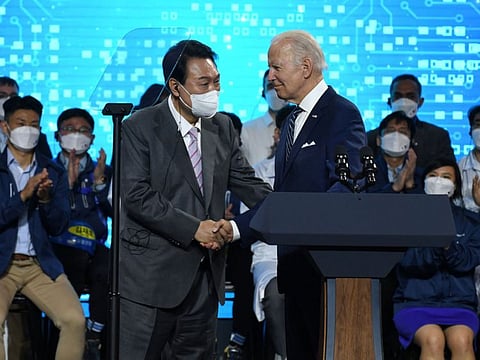 U.S. President Joe Biden shakes hand with South Korean President Yoon Suk-youl after a press conference at the Samsung Electronic Pyeongtaek Campus in Pyeongtaek, South Korea, May 20 2022.
