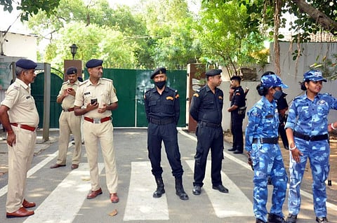Police personnel stand guard outside Rashtriya Janata Dal (RJD) Chief Lalu Prasad Yadav's residence as CBI conducts a raid, in Patna on Friday, May 20, 2022.