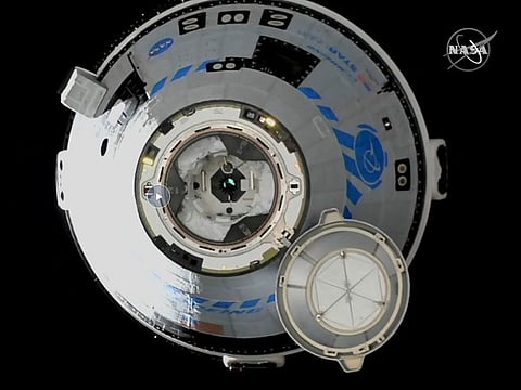 This image from NASA TV shows the Boeing Starliner approaching the International Space Station, Friday, May 20, 2022.
