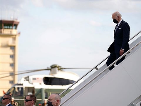 President Joe Biden disembarks from Air Force One on his arrival at Yokota Air Base, near Tokyo, on May 22, 2022.