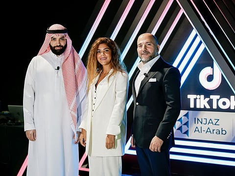 Akef Alaqrabawi (right) with Talal Al Fayez (left) and TikTok's Raghdah Alazab.