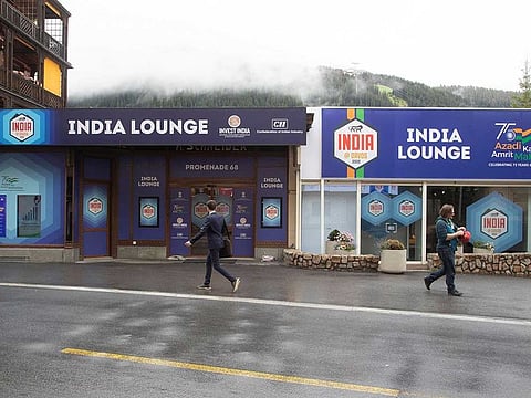 People walk past the India Lounge during the World Economic Forum 2022 (WEF) in the Alpine resort of Davos, Switzerland May 25, 2022.
