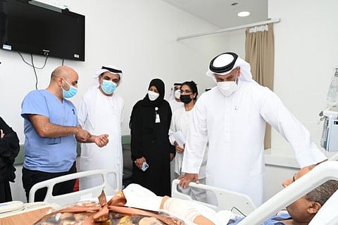 Top Abu Dhabi health officials Abdullah Al Hamed and Dr Jamal Al Kaabi visit the injured at a hospital in Abu Dhabi, a day after the incident.